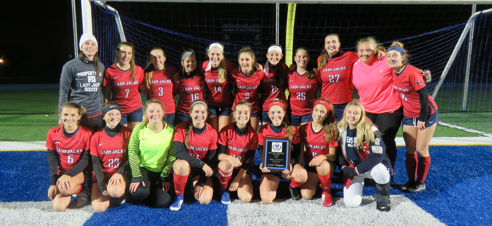 The North Tonawanda girls soccer team poses with the Niagara Frontier League plaque following Wednesday night's victory over Grand Island. The title is the team's first since 1985. (Photo by David Yarger)